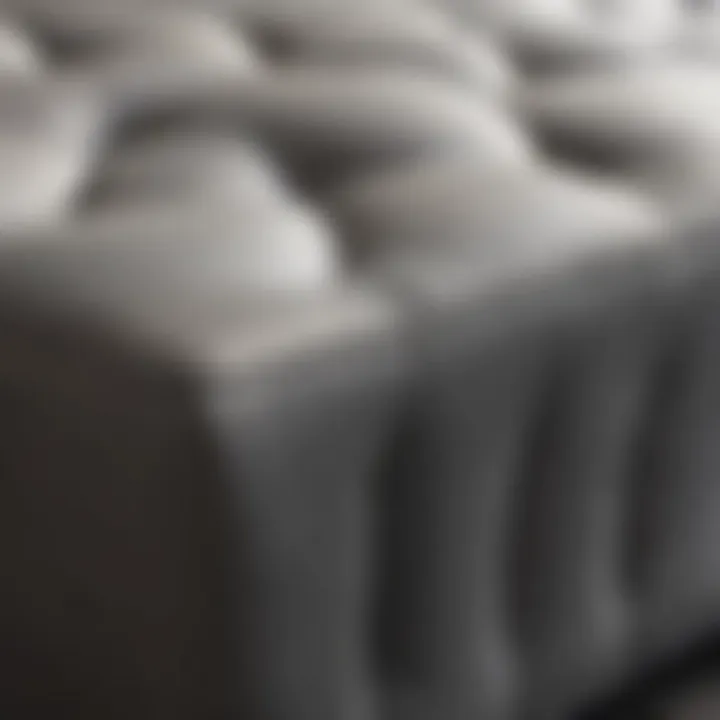 Close-up of materials and textures used in a big grey ottoman design