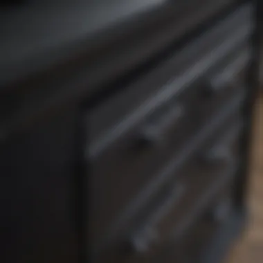 Close-up of the material and finish of a black chest of drawers