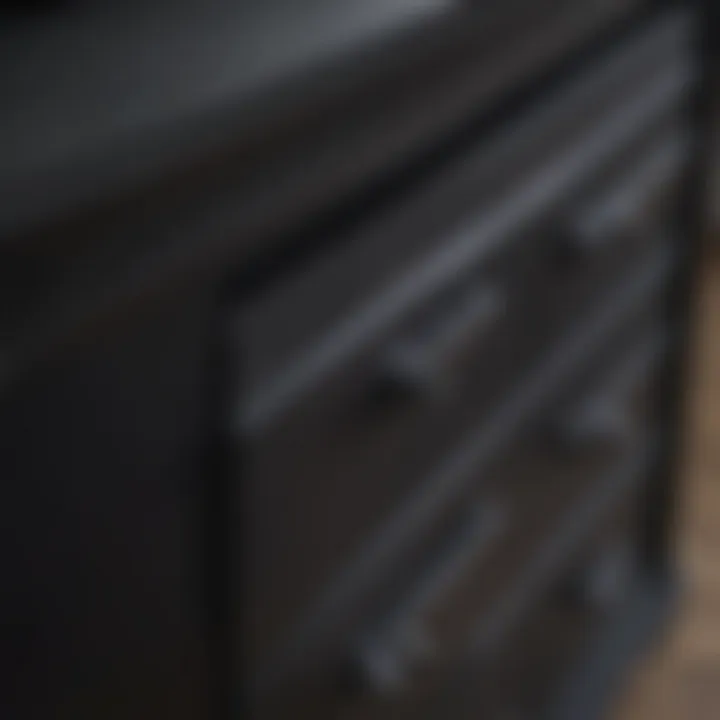 Close-up of the material and finish of a black chest of drawers