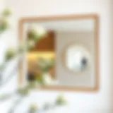 An Elegant Reflection Elegant white mirror framed in natural wood