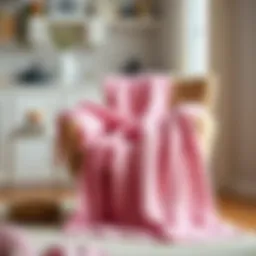 Luxurious pink knitted throw draped elegantly over a cozy armchair