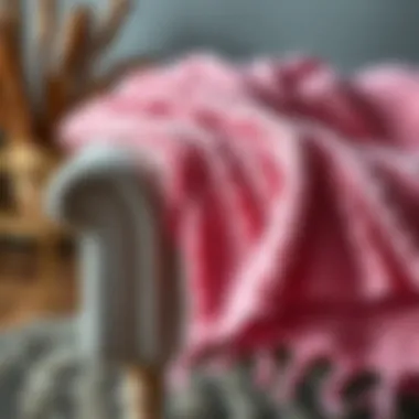 Sustainable Crafting of Pink Knitted Throws Sustainable materials used in crafting a pink knitted throw displayed artistically