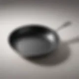 A close-up of a non-stick frying pan showcasing its smooth surface